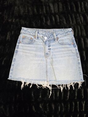 American Eagle Outfitters Light Blue Denim Mini Skirt with Frayed Hem